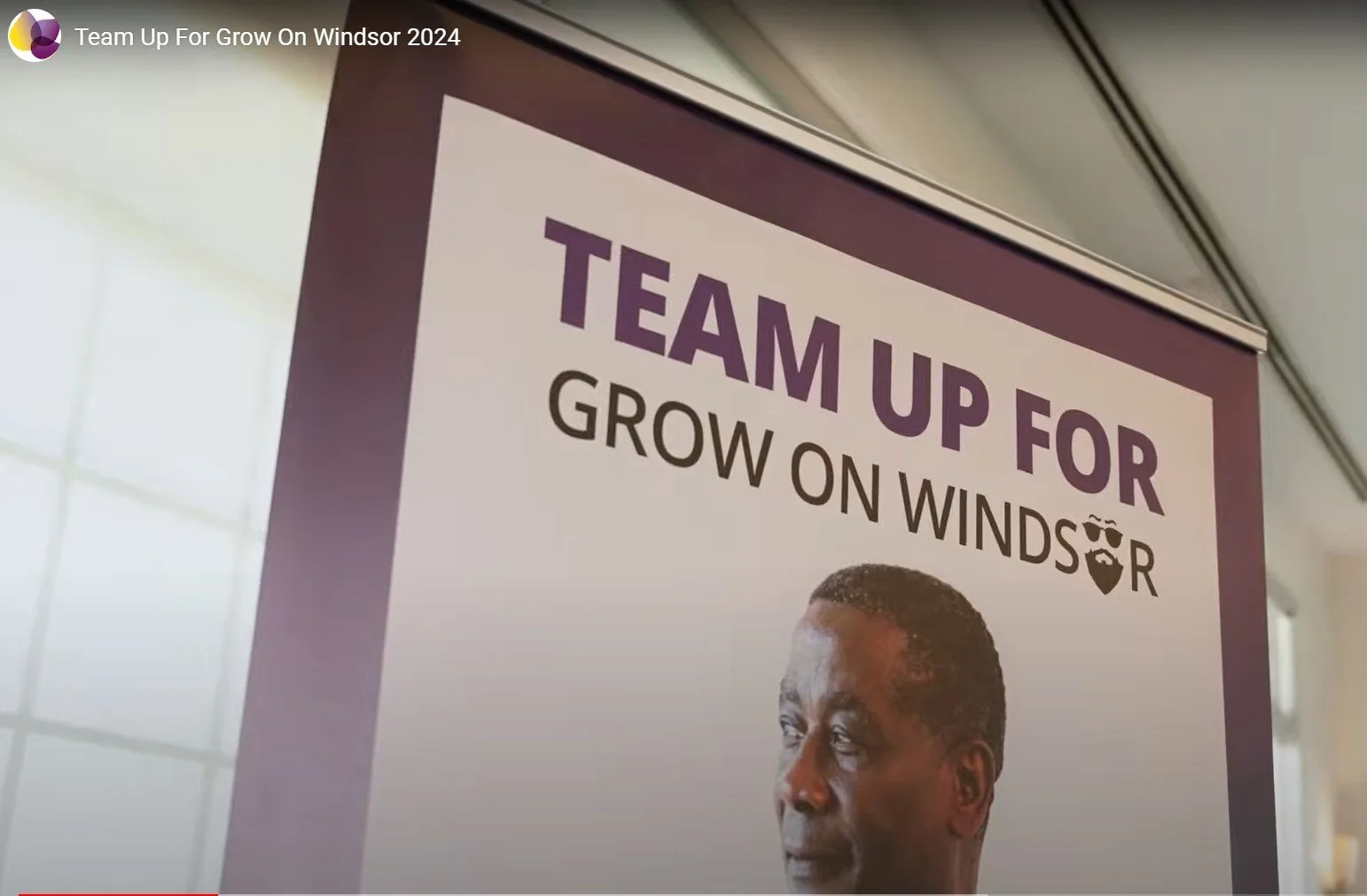 A Team Up For Grow On Windsor banner on display at the campaign event.